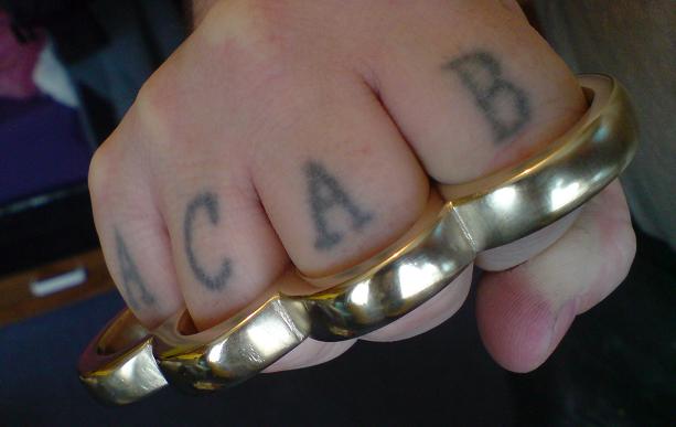 brass knuckles tattoos. rass knuckle tattoo.