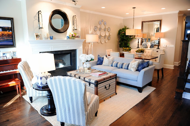 a living room in coastal style shows uniqueness with its crest-like table