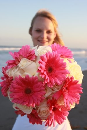 Different hue gerbera daisies and light pink roses wedding bouquet