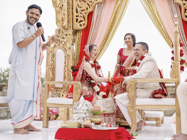 bride and groom laughing during indian ceremony