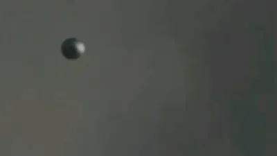 Silver metallic UFO sphere or Orb sighting over New York.