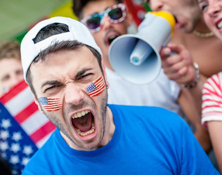 Man With Face Painting Of USA Flag