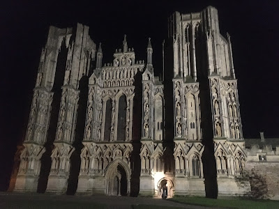 Photo of West Front of Wells Cathedral, floodlit against a night sky