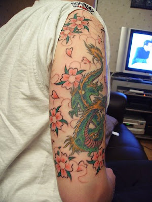 celtic dragon tattoo tattoo sleeve consists of cheery blossom tattoo and 