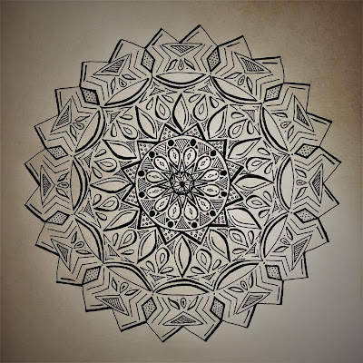 a detailed hand drawn mandala