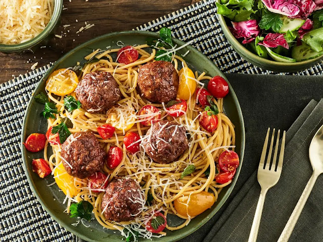 Step-by-step process of making homemade meatballs like a pro, including mixing, shaping, and cooking techniques