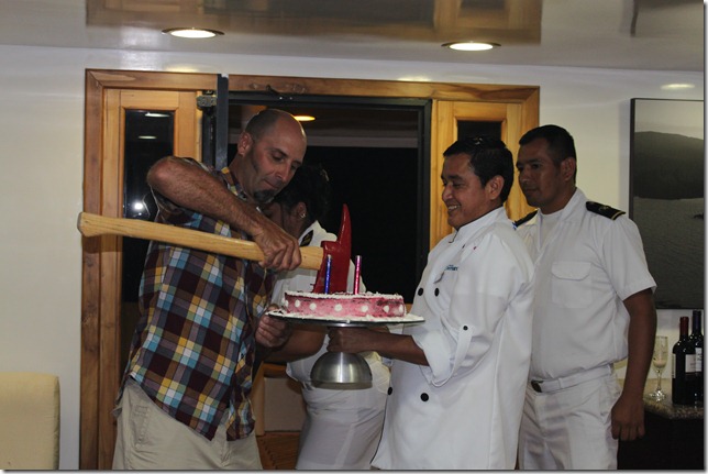MIKE CUTTING HI CAKE WITH AXE