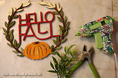 Hello fall sign, floral cutters, hot glue and faux foliage