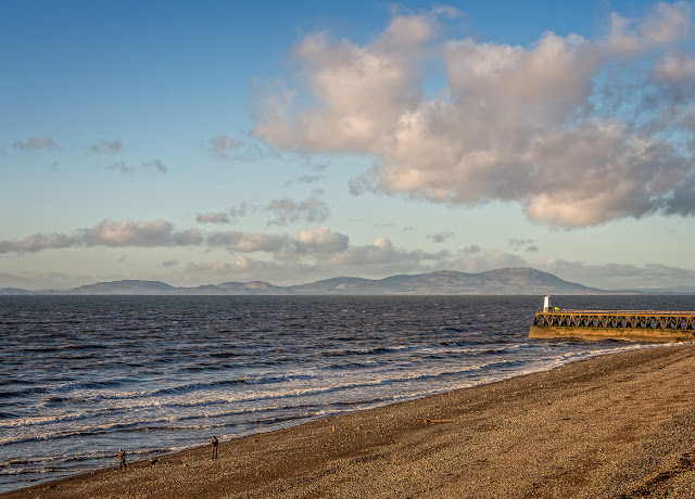 Photo of Grasslot shore at Maryport with with the Scottish hills in the distance