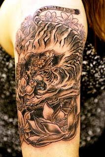 http://allaboutbodyart.blogspot.com/ tiger_tattoo_japanese_girl_half_sleeve_tattoos_design_chinese_astrology_tattoo