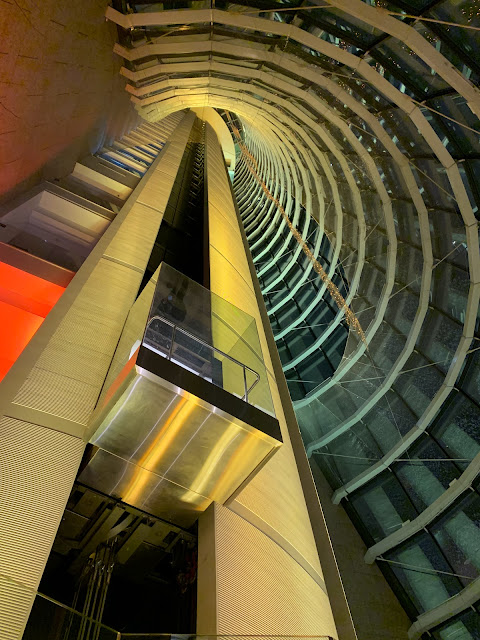 Panoramic glass elevators serving the 20 floors