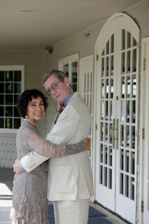 Mina and Jeff on the veranda of The Columia Winery on their wedding day.