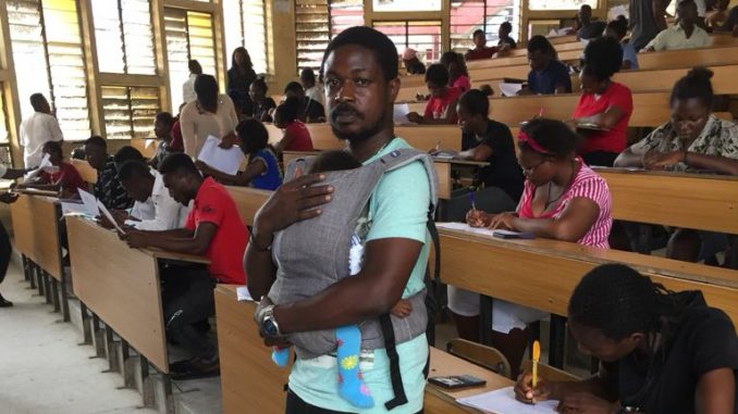 Shocking!! Unical lecturer baby sits his students child during an exam 