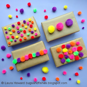 Brown paper parcels decorated with colourful pompoms