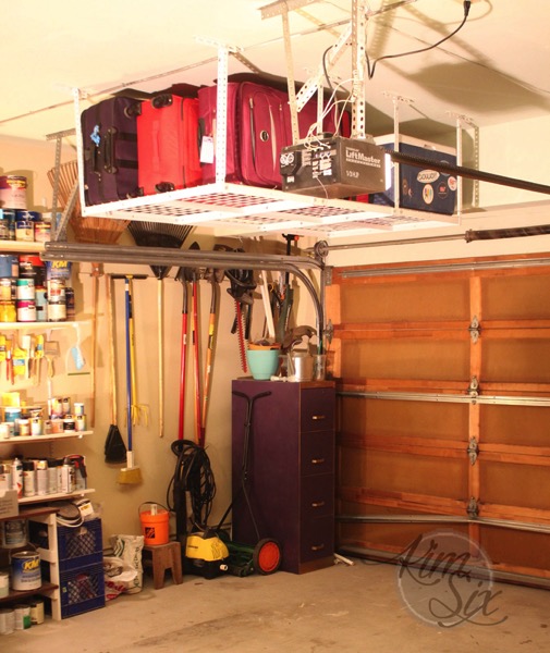 Storage over garage door with hanging rack