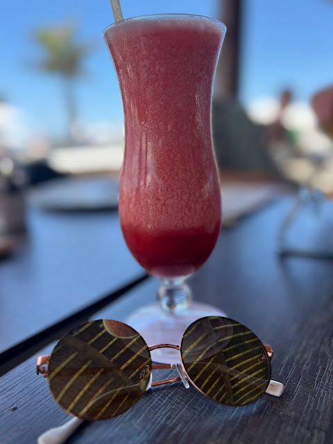 cocktail in glass with sunglasses