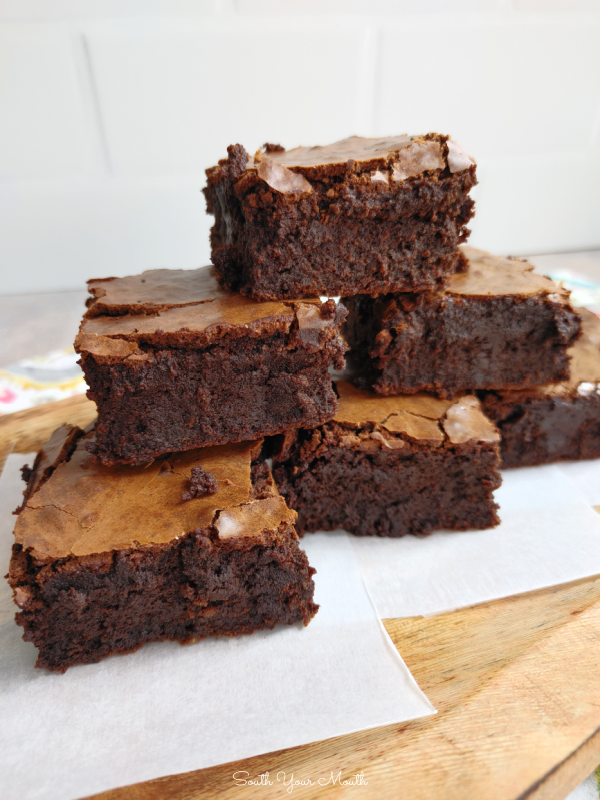 Crackle Top Fudge Brownies! A decadent recipe for thick, fudgy homemade brownies with glossy, crackly tops and intense chocolate flavor.