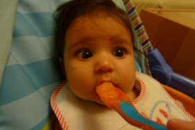 Baby being fed with a puree