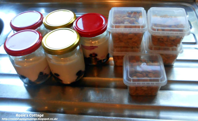 Meal prepping for an easier week ahead: I use small glass jars and add fruit such as blueberries or strawberries and top with natural yogurt.  I then fill tiny tubs with healthy snacks, such as nuts, to avoid visits to the vending machines. #mealprepping