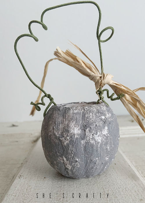 Use wire to make a stem for the cement look pumpkins.