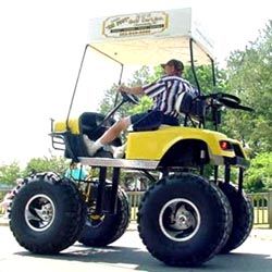 Pro golfing cart 4 by 4 wheel drive in a fire yellow color