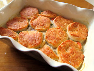 Chicken pot pie topped with buttermilk biscuits as the crust