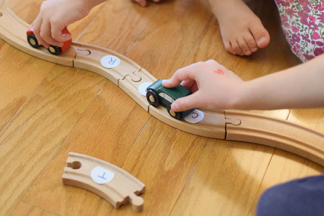 Train Track Word Building- Fun and easy literacy activity inspired by the book Old Tracks New Tricks. Great preschool or kindergarten activity for teaching sight words, phonics, or CVC words to beginning readers.