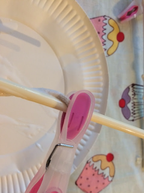 A peg holding on a piece of string to the chopstick