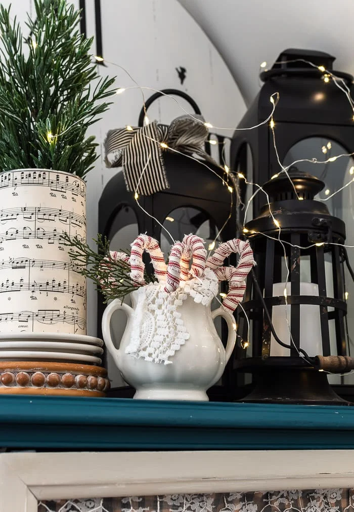 ironstone sugar bowl, candy canes, vintage sheet music tree stand, lanterns