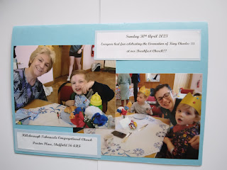 The front of the card we signed for the King, with photos of people enjoying Breakfast Church