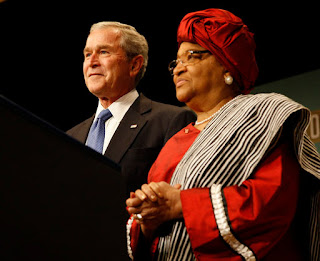President George W. Bush stands with Liberian President Ellen Johnson Sirleaf