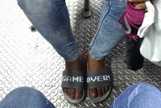 GAME OVER WRITTEN ON SLIPPERS