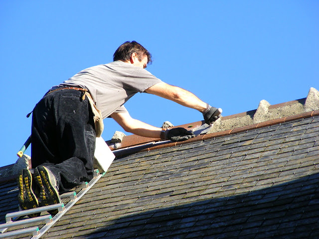 Sculpting a roof crest repair, Indre et Loire, France. Photo by Loire Valley Time Travel.