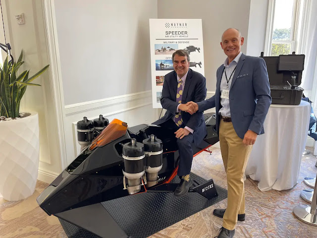 American investor Tim Draper on the P2 Speeder shaking hands with CEO of Mayman Aerospace David Mayman