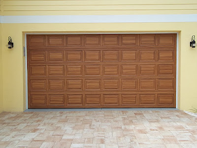 double garage door painted to look like wood.