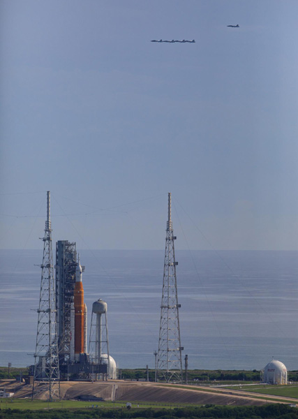 Five T-38 aircraft carrying NASA astronauts and photographers perform a flyover of the Space Launch System rocket at Kennedy Space Center's Pad 39B in Florida...on August 23, 2022.