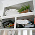 How to easily organize awkward pans above the fridge
