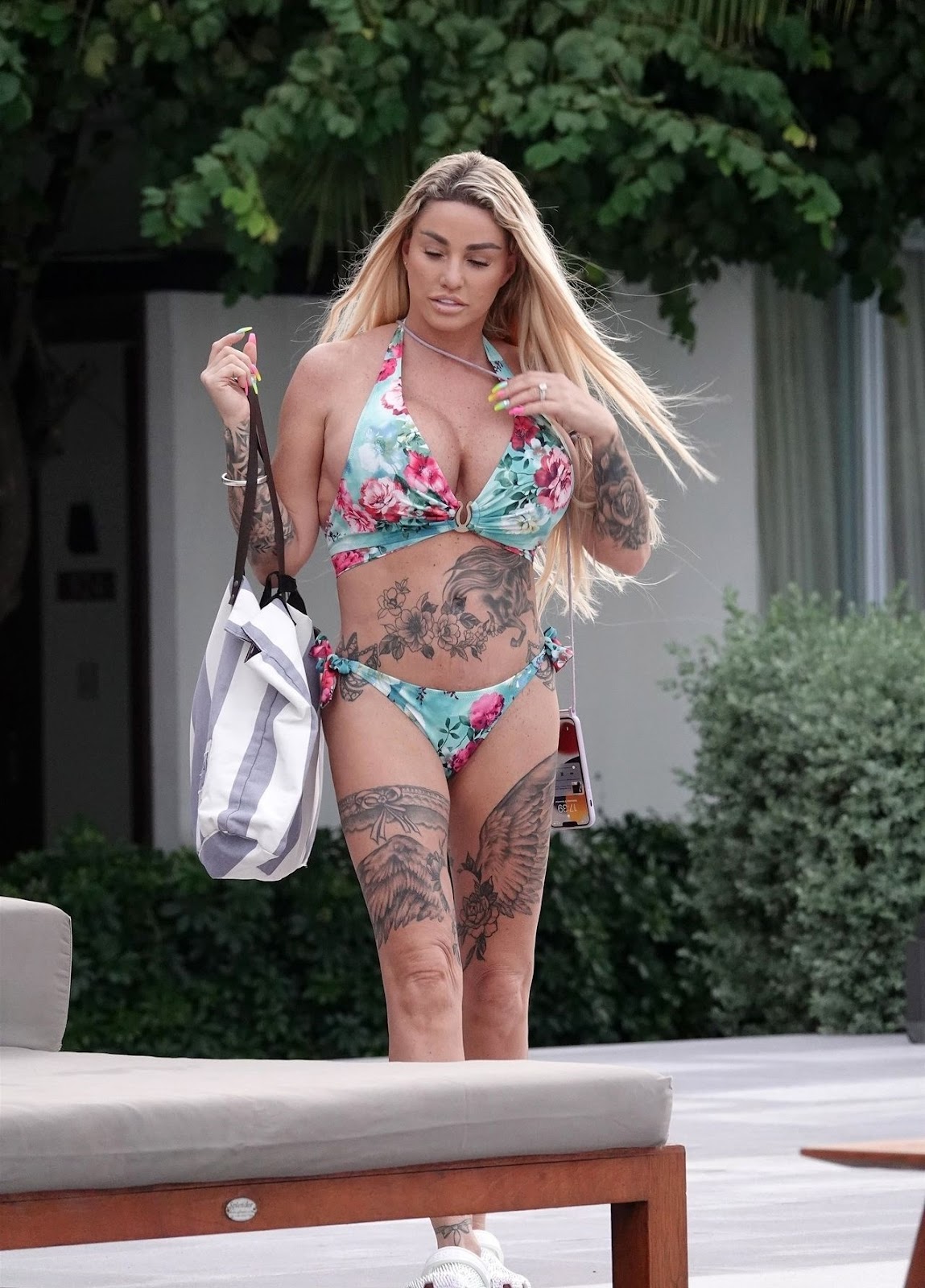 Katie Price shows off tattooed body as she visits cosmetic surgeon ‘for 16th boob job’ on holiday in Thailand