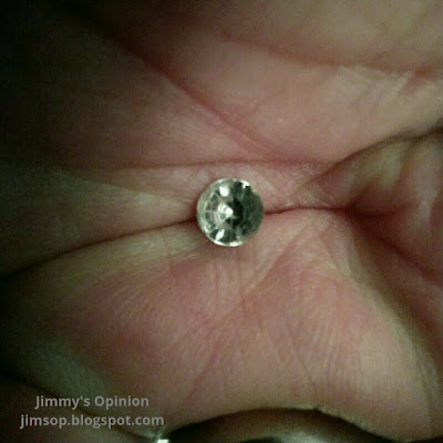 A diamond rhinestone laying in the palm of my hand.