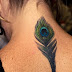 Peocock Feather Tattoos On Women Neck