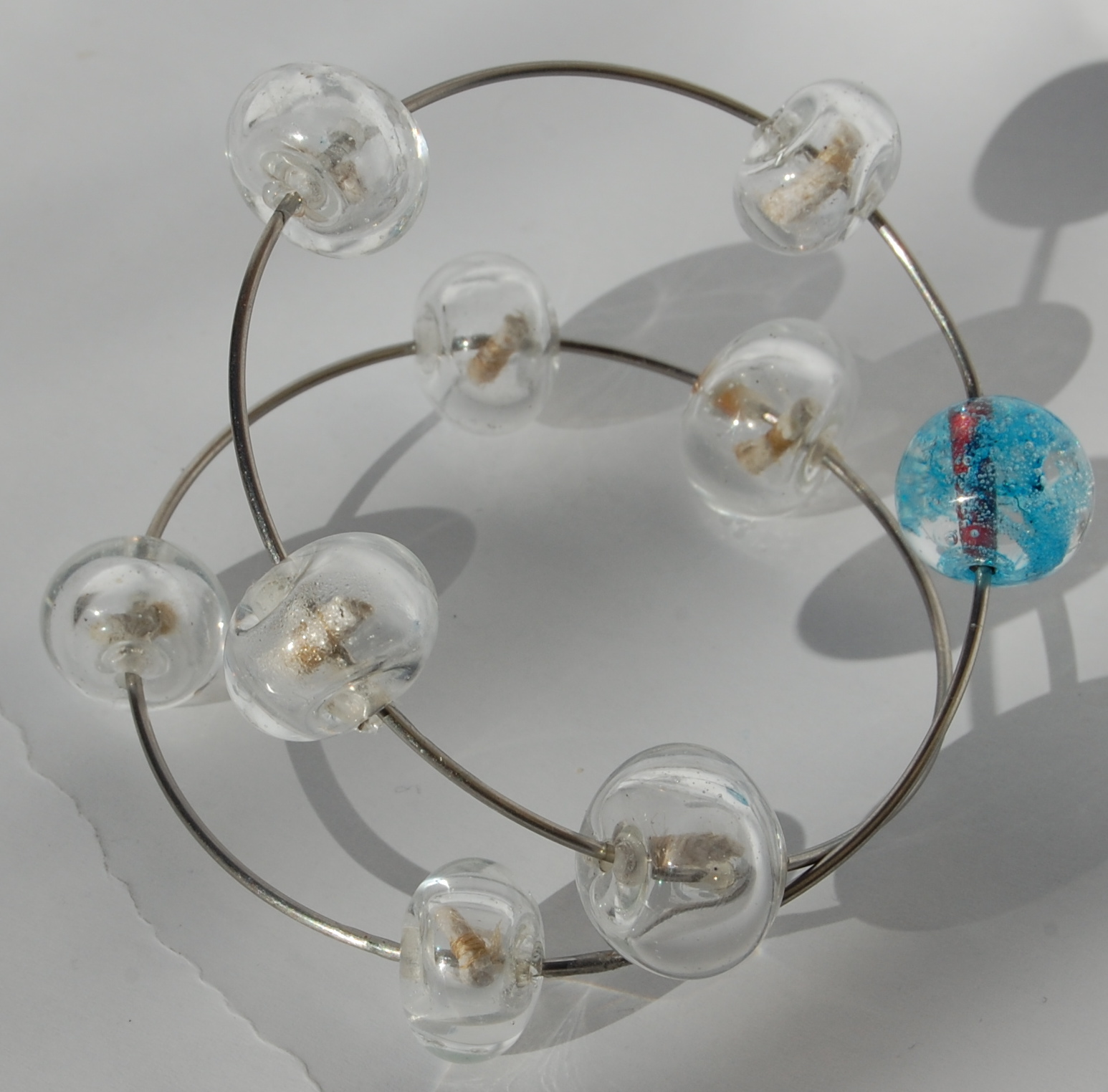 ... yet traveled, bracelet - Stainless steel, glass, paper, copper. 2010