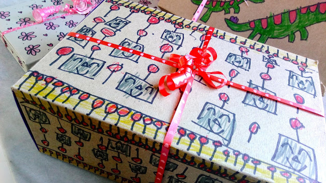 a robot decorated Valentine's Day gift box tied with a red ribbon