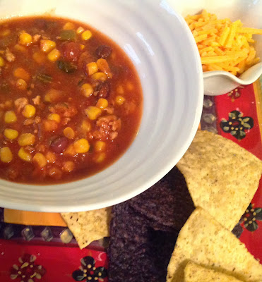 Chicken Chili served with Cheese, Sour Cream, and Chips