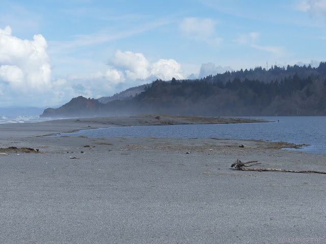 sand spit and lagoon and fisherman