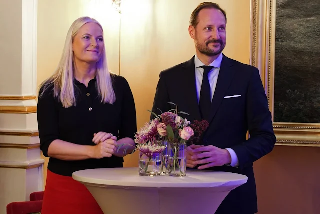 Crown Princess Mette-Marit wore a red wesley midi skirt by Gabriela Hearst. Minister of Culture and Equality Lubna Jaffery