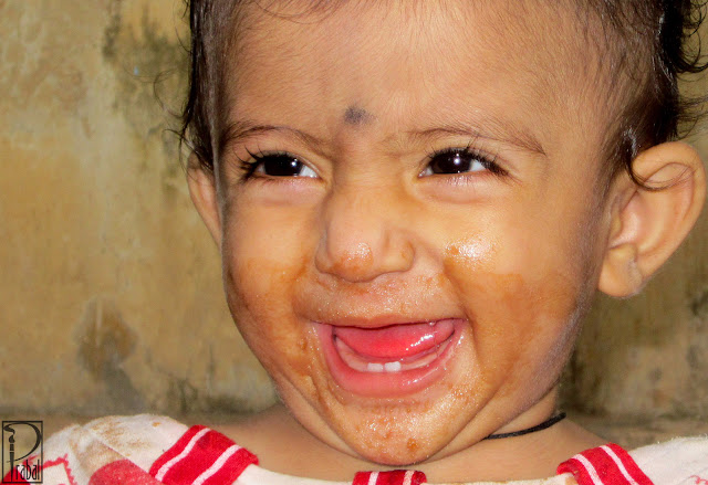 This is a photograph of a smiling baby