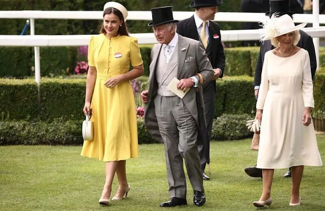 Queen Camilla wore a silk dress by Anna Valentine, Lady Gabriella a Claire Mischevani dress, and Lady Sophie a yellow dress by Beulah