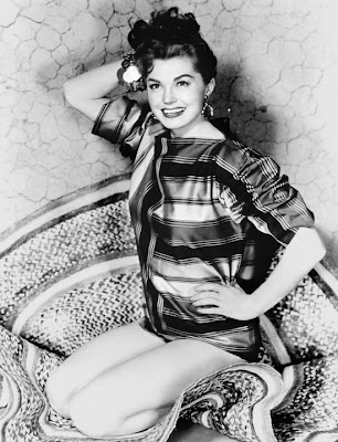 There are many, many really bad pictures of Esther Williams with bad 50s hair. This is one of the good ones.