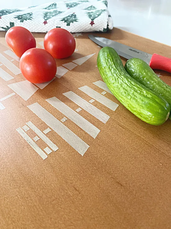 tomatoes and cucumbers on cutting board