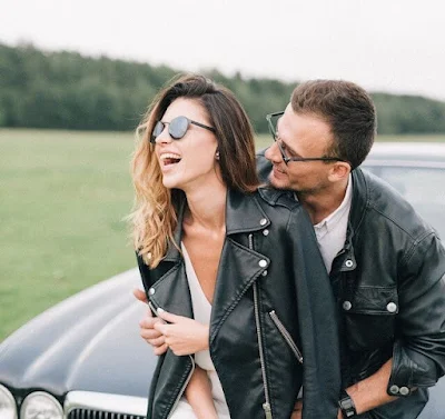 A Happy Couple Wearing Stylish Black Leather Jackets
